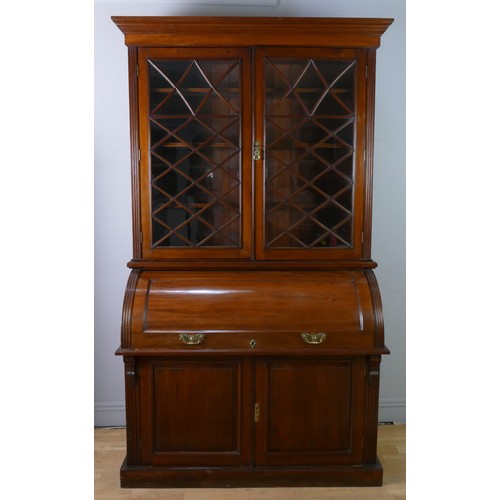 354 - John Easten & Sons, Hull, a late Victorian mahogany bureau bookcase, the outswept pediment over a pa... 