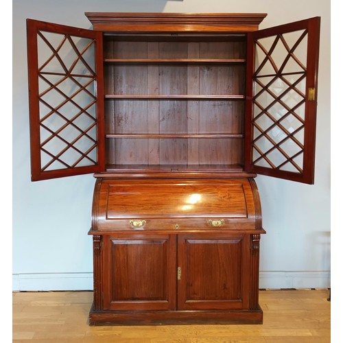 354 - John Easten & Sons, Hull, a late Victorian mahogany bureau bookcase, the outswept pediment over a pa... 