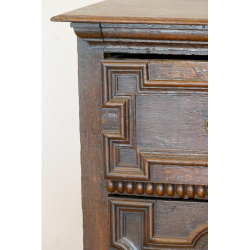 356 - A late 17th century oak chest of three long drawers, two plank top over geometric moulded drawer fro... 