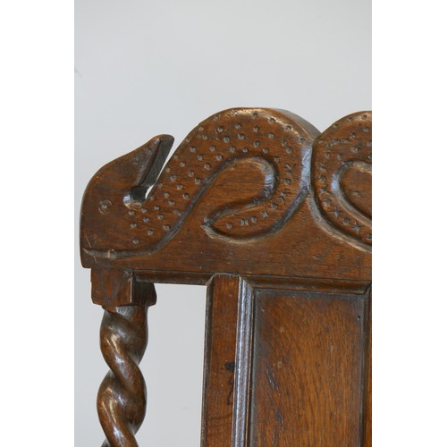 358 - An 18th century and later oak hall chair, with carved S scroll top rail, panel back with turned supp... 