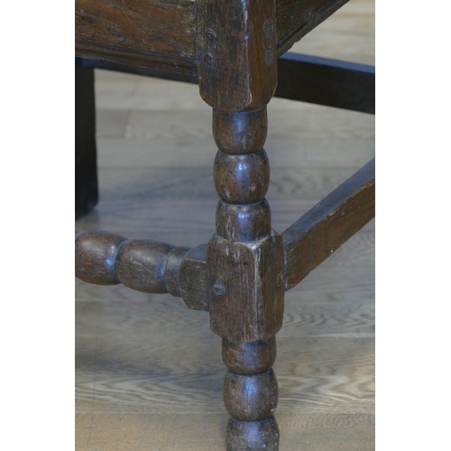 358 - An 18th century and later oak hall chair, with carved S scroll top rail, panel back with turned supp... 