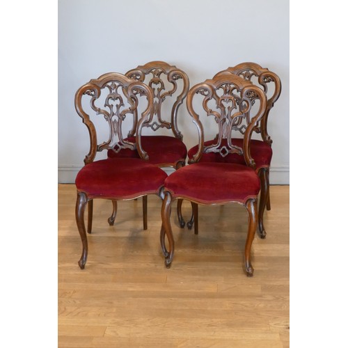 363 - A Victorian set of four mahogany parlor chairs, carved scroll backs, upholstered seats and cabriole ... 