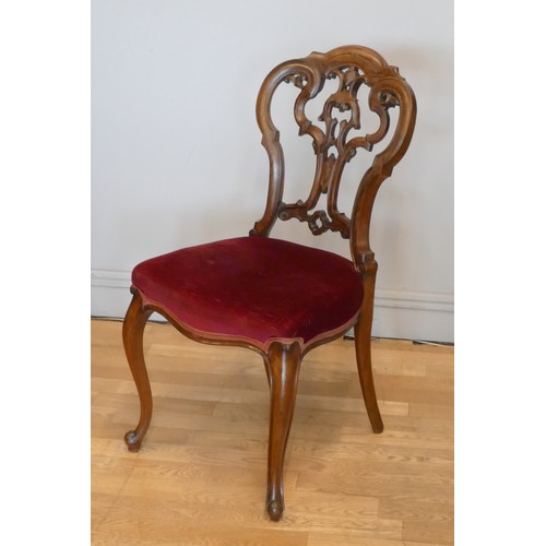 363 - A Victorian set of four mahogany parlor chairs, carved scroll backs, upholstered seats and cabriole ... 