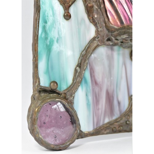 372 - John Leathwood, Hull, an arched wall mirror with night light candle holder, with multi coloured stai... 