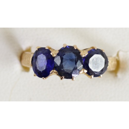 154 - A gold and three stone sapphire ring, tests 18ct, claw set with oval mixed cuts stones, 6 x 5mm larg... 
