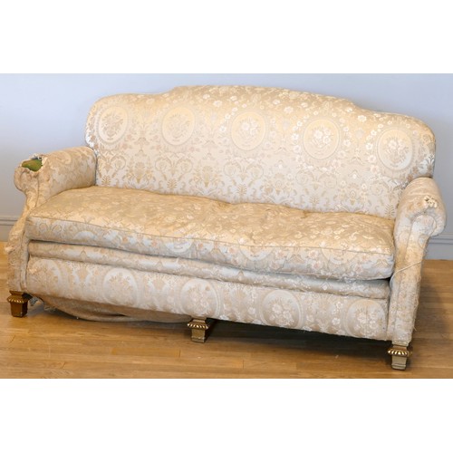 352 - An early 20th century mahogany framed three seat sofa, with shaped back, sweep back and scroll arms,... 