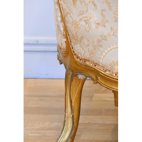 353 - A Louis XV style mahogany framed wing back armchair, with carved giltwood frame, sprung upholstered,... 