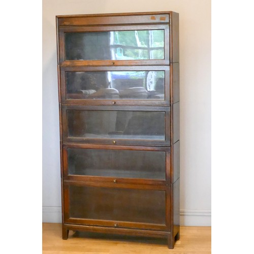 357 - An oak five section Globe Wernike type bookcase, with plain glass doors, 170 x 87 x 25cm.