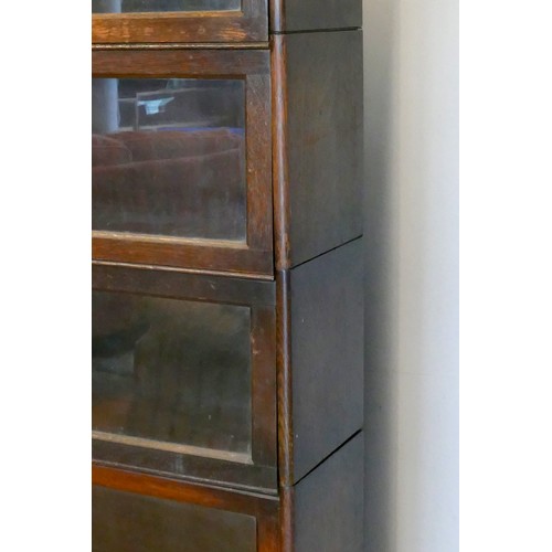 357 - An oak five section Globe Wernike type bookcase, with plain glass doors, 170 x 87 x 25cm.