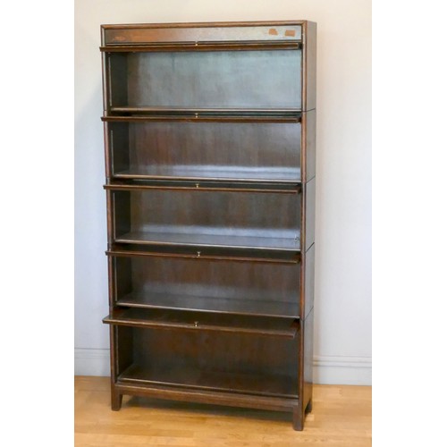 357 - An oak five section Globe Wernike type bookcase, with plain glass doors, 170 x 87 x 25cm.