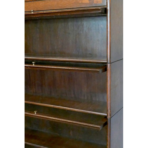 357 - An oak five section Globe Wernike type bookcase, with plain glass doors, 170 x 87 x 25cm.