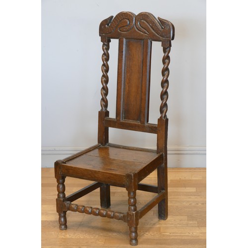 358 - An 18th century and later oak hall chair, with carved S scroll top rail, panel back with turned supp... 