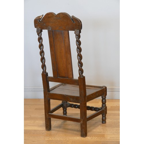 358 - An 18th century and later oak hall chair, with carved S scroll top rail, panel back with turned supp... 