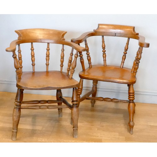 362 - A near pair of Victorian ash and elm captains chairs, scroll arms and turned supports, one stamped A... 