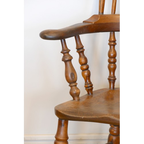 364 - A Victorian ash and elm Windsor high back arm chair, with scroll splat and turned supports, 113cm.