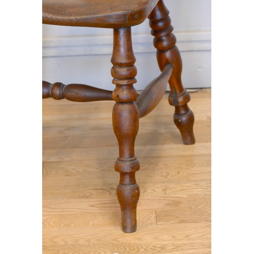 364 - A Victorian ash and elm Windsor high back arm chair, with scroll splat and turned supports, 113cm.