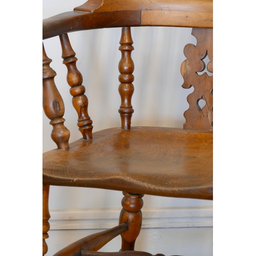 364 - A Victorian ash and elm Windsor high back arm chair, with scroll splat and turned supports, 113cm.