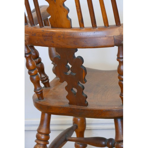 364 - A Victorian ash and elm Windsor high back arm chair, with scroll splat and turned supports, 113cm.