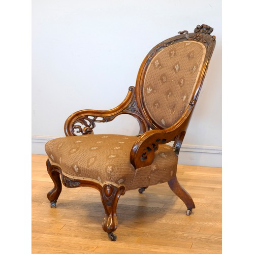 367 - A Victorian carved rosewood button back parlour chair, with carved cabriole front supports, 97 x 72c... 