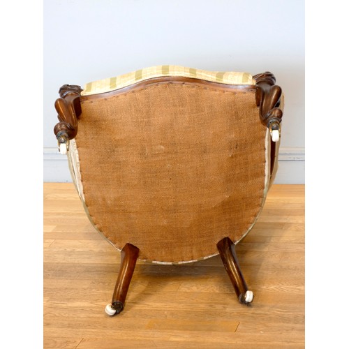 371 - A Victorian carved mahogany button back parlour chair, padded arms, with carved cabriole front suppo... 