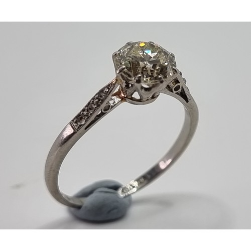 179 - An Edwardian single stone diamond ring, tests as platinum, by S & Co., claw set with an old cut bril... 