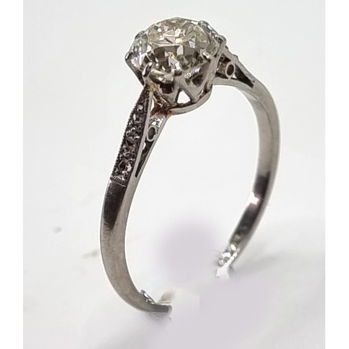 179 - An Edwardian single stone diamond ring, tests as platinum, by S & Co., claw set with an old cut bril... 