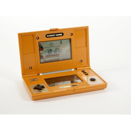 61 - A Nintendo Game & Watch (Donkey Kong) multiscreen handheld game (serial No 42146207), together with ... 