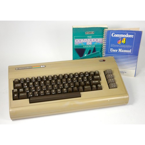 84 - A Commodore 64 (serial No UKB 150543), AV and power cable, with manual and handbook