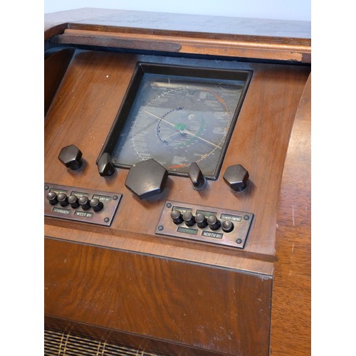 94 - An un-branded floor standing valve radio (serial No 34896), believed to be 1930s, mahogany case, wit... 