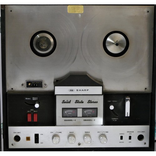 A Sharp solid state reel to reel player, with intergrated speakers,  together with a Ferguson solid s