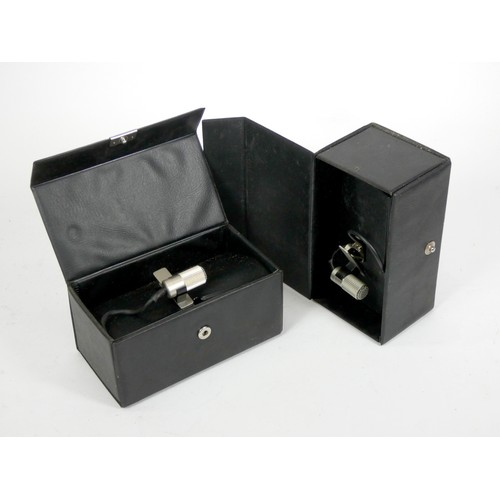 140 - An Eagle M90 unidirectional microphone, original box and cable, together with a Primo EM-4000 lapel ... 