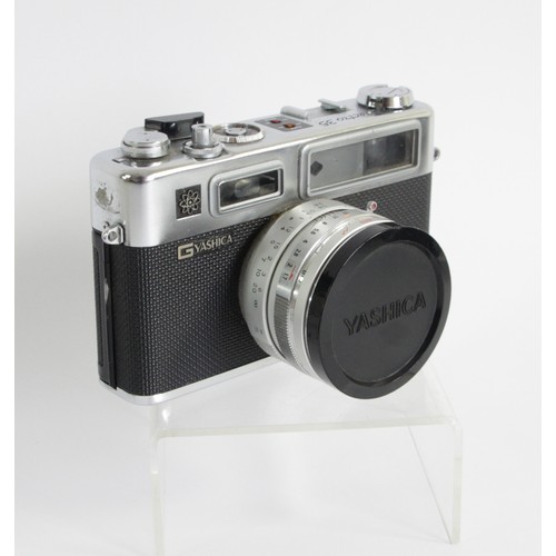 168 - A Yashica 35 film camera, in carry case, also including a Yashikor Aux Telephoto convertor f4 and a ... 