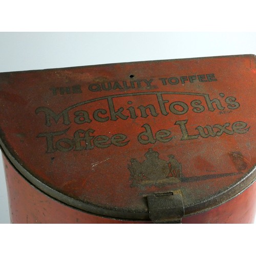 176 - A Mackintosh's Toffee De Luxe shop counter advertising tin, c.1920, flat back, moon shaped, 36cm tal... 