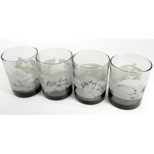 181 - A set of four McDonalds USA smoked glass Hawaii Tiki tumblers, c.1970s, depicting Hawaiian themed wa... 