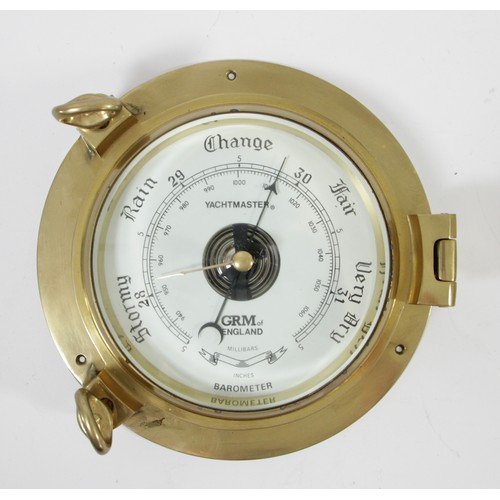 192 - A brass ships bulkhead portal barometer, Yachtmaster by GRM of England, the barometer hinged, glass ... 