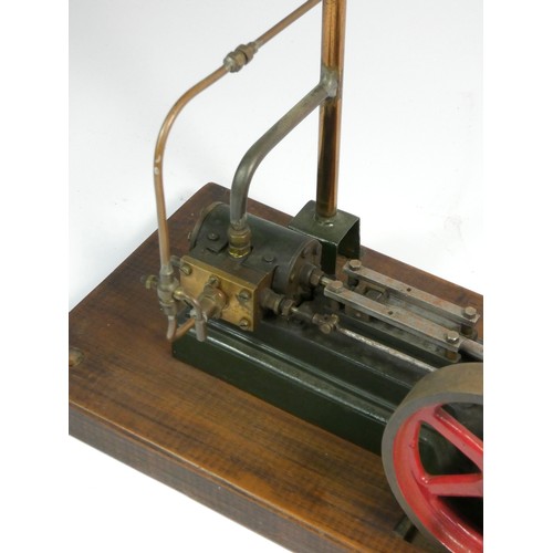 222 - A Stuart static steam engine, mounted on a wooden base, 30.5cm x 15cm