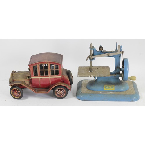 225 - A tinplate car, friction rear wheel producing a mock engine noise, together with a Vulcan sewing mac... 