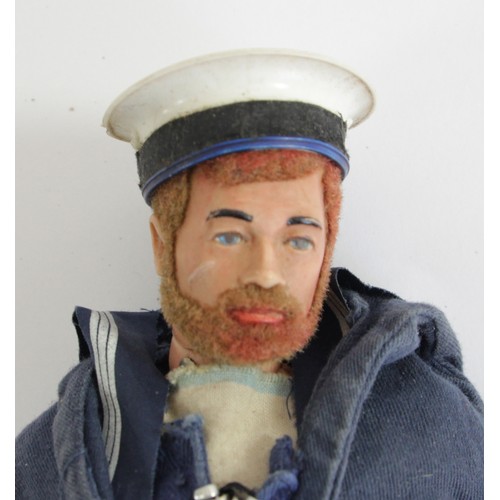 226 - A Action Man, realistic hair and beard, in a Navel outfit, together with a collection of accessories... 