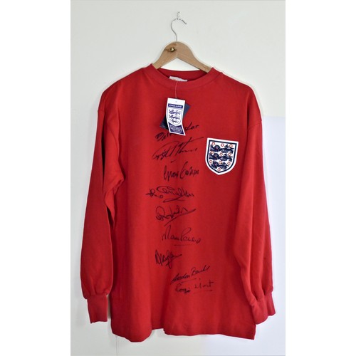 290 - A 1966 World Cup replica red shirt, signed by eight players, Hurst, Cohen, Jack Charlton, Wilson, Pe... 