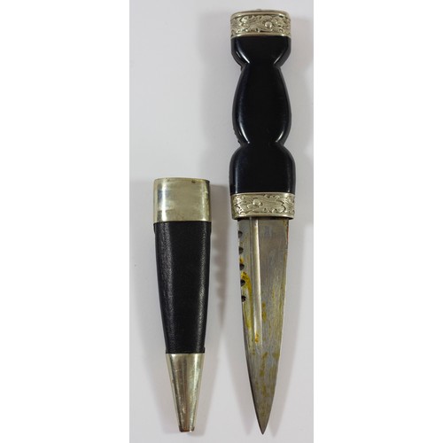 360 - Three Scottish Sgian Dubh, the composite hilt with woven decoration, embossed crown pommel, leather ... 