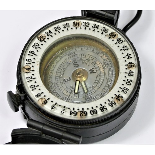 369 - A M-73 black prismatic MILS x 100 compass with silvered dial.