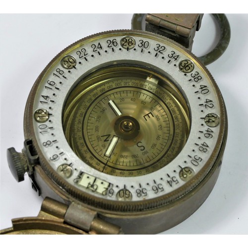 370 - A Stanley, London brass prismatic hand held compass, together with a pair of gaiters and a beret