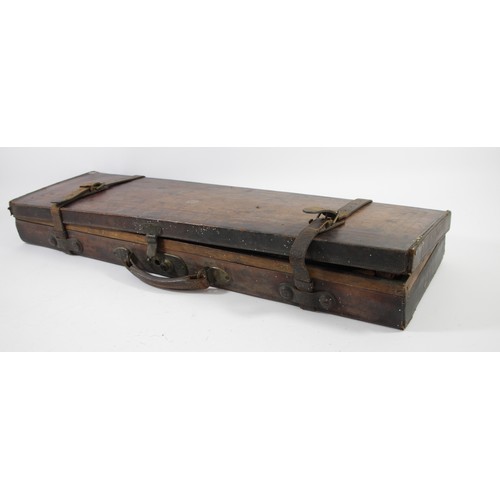 372 - A leather shotgun case, with straps, containing various cleaning materials