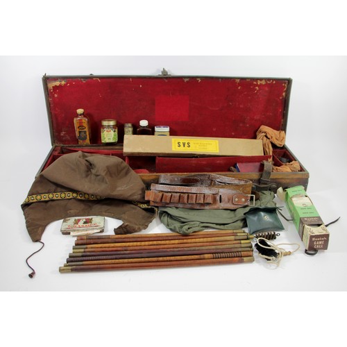 372 - A leather shotgun case, with straps, containing various cleaning materials