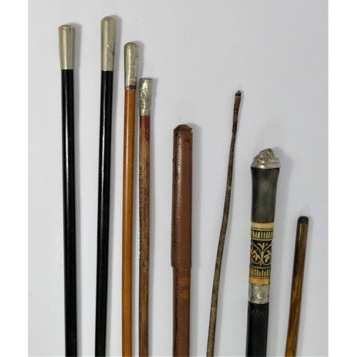 377 - A swagger stick with West Yorkshire Regimental crest, three other swagger sticks with crests and fou... 