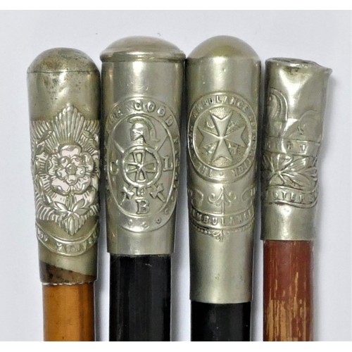 377 - A swagger stick with West Yorkshire Regimental crest, three other swagger sticks with crests and fou... 