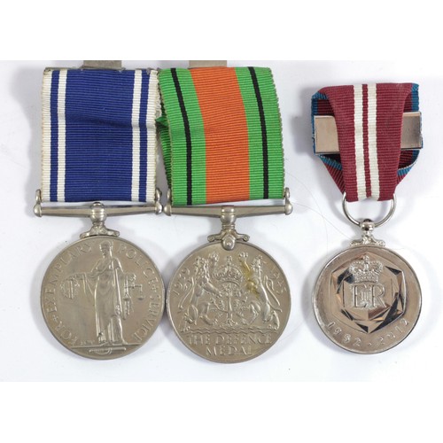 408 - Pair, ER II Police Long Service, awarded to Const. James Grainger and WWII Defense Medal, together w... 