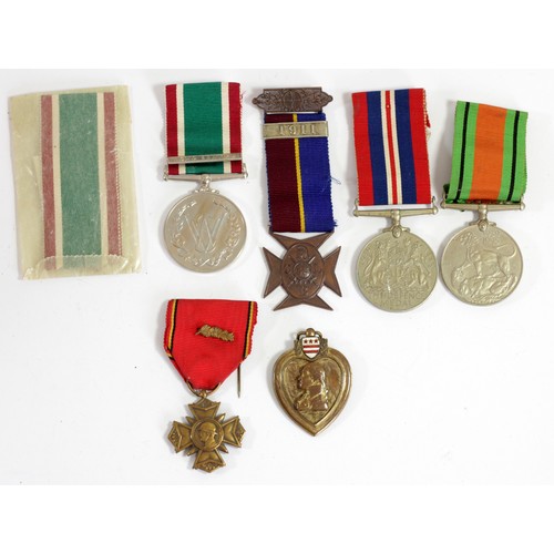 422 - A Purple Heart, a Women's Voluntary Service Medal, case, two WWII medals, a Lads Church Brigade meda... 