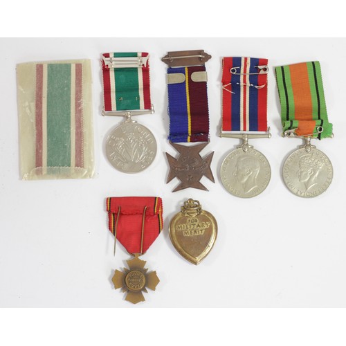 422 - A Purple Heart, a Women's Voluntary Service Medal, case, two WWII medals, a Lads Church Brigade meda... 