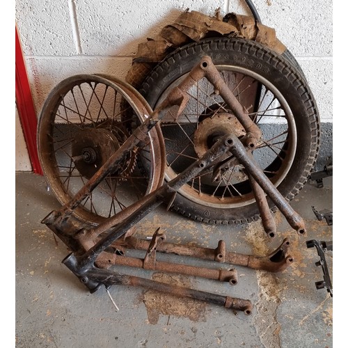 95 - A believed 1930's AJS frame, two other frames two wheels and a NOS tyre